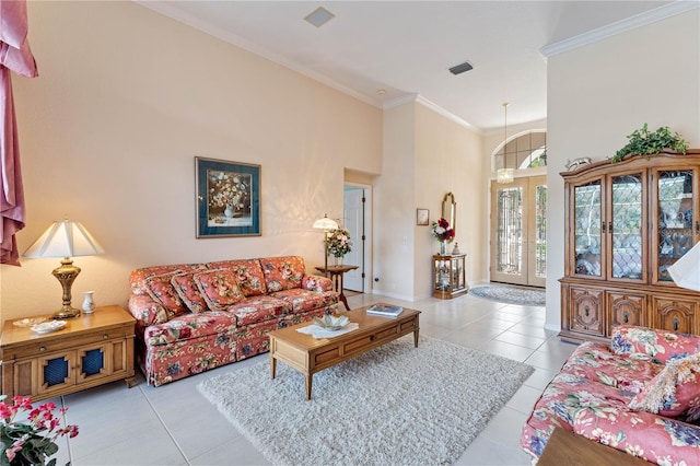 living room featuring crown molding, light tile patterned floors, and french doors