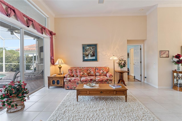 living room with light tile patterned floors, crown molding, and ceiling fan