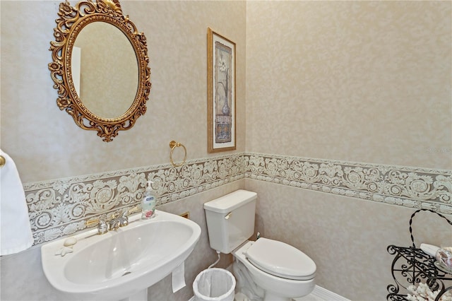 bathroom with sink and toilet