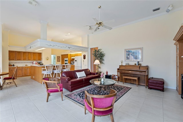 tiled living room featuring crown molding and ceiling fan