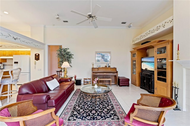 tiled living room featuring crown molding and ceiling fan