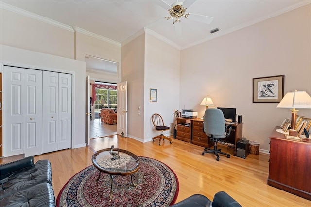 office with crown molding and light wood-type flooring