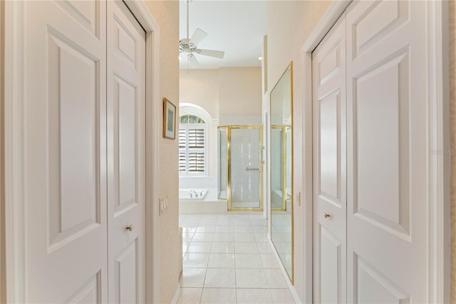 hallway featuring light tile patterned floors