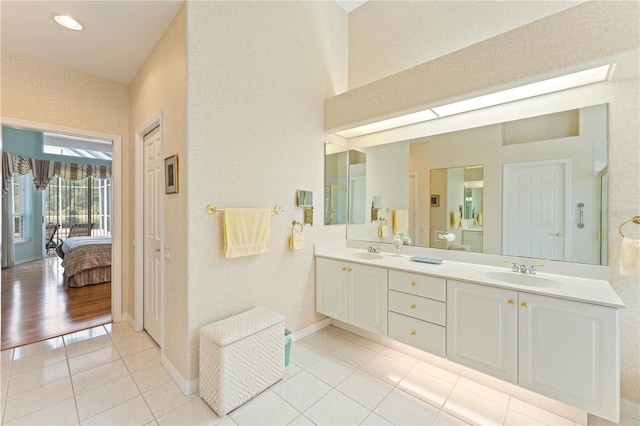 bathroom featuring tile patterned flooring and vanity