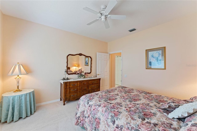 bedroom featuring light carpet and ceiling fan