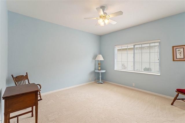 sitting room with light carpet and ceiling fan