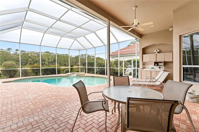 view of swimming pool featuring an in ground hot tub, area for grilling, glass enclosure, and a patio area