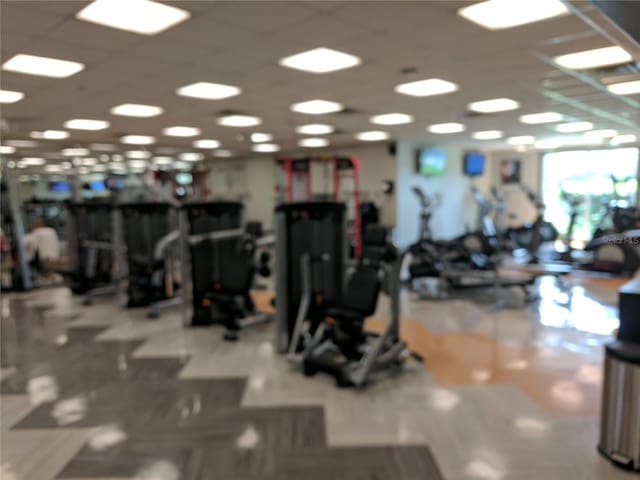 gym featuring a drop ceiling