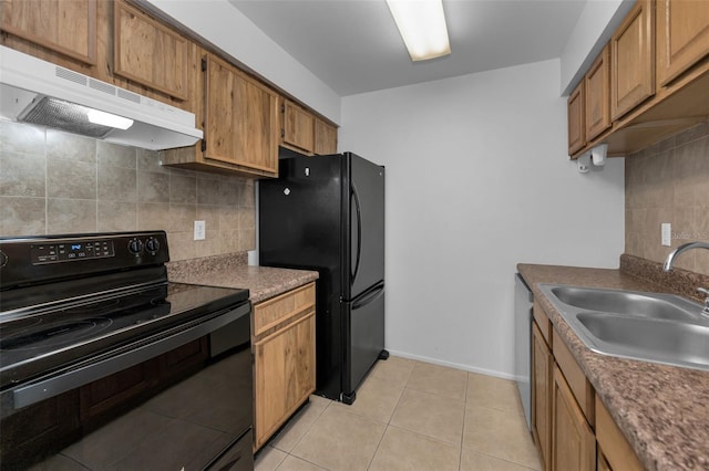 kitchen featuring light tile patterned floors, sink, backsplash, and black appliances