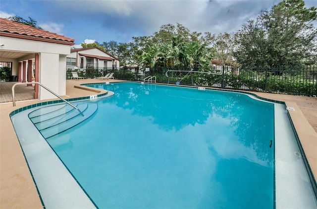 view of swimming pool featuring a patio