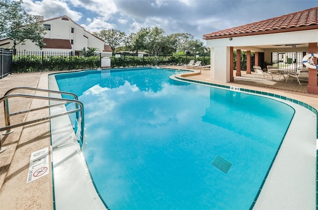 view of swimming pool with a patio area