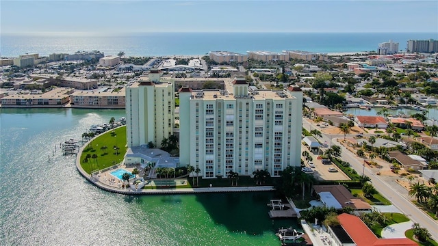 birds eye view of property with a water view and a city view