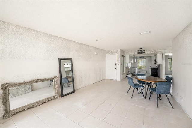 7300 Sunshine Skyway Ln S Unit 108, Saint Petersburg, FL 33711 - dining space featuring a textured ceiling and light tile patterned flooring