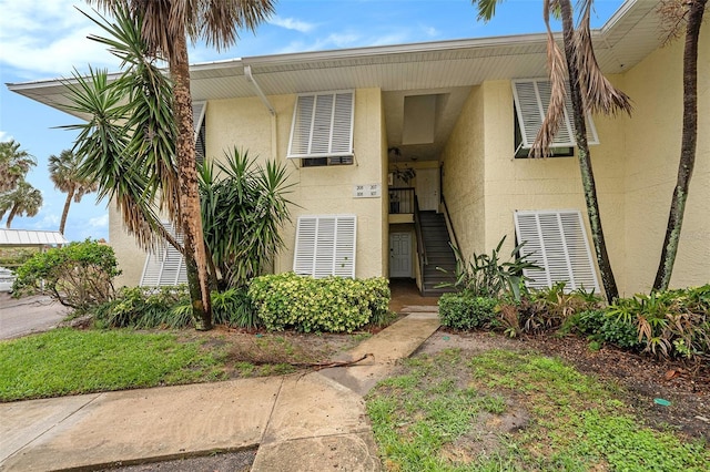 7300 Sunshine Skyway Ln S Unit 108, Saint Petersburg, FL 33711 - property entrance featuring stucco siding
