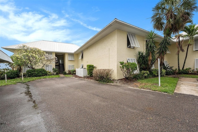 7300 Sunshine Skyway Ln S Unit 108, Saint Petersburg, FL 33711 - townhome / multi-family property featuring stucco siding