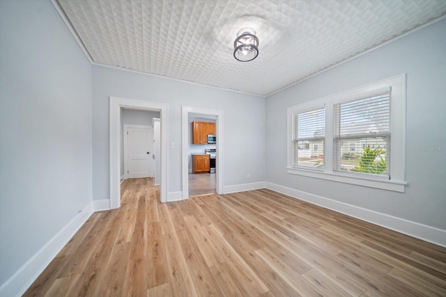 empty room with light hardwood / wood-style floors