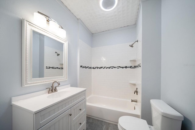 full bathroom with toilet, vanity, and tiled shower / bath