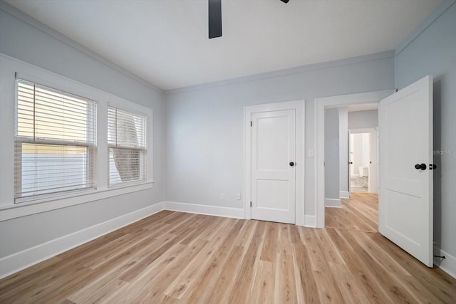 unfurnished room with ceiling fan, light hardwood / wood-style floors, and crown molding