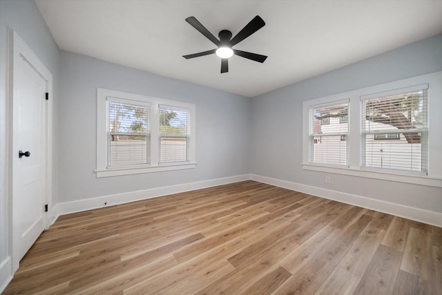 spare room with ceiling fan and light hardwood / wood-style flooring