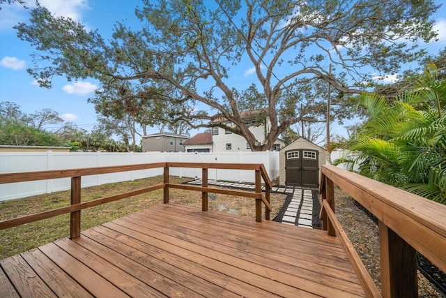 wooden terrace featuring a shed