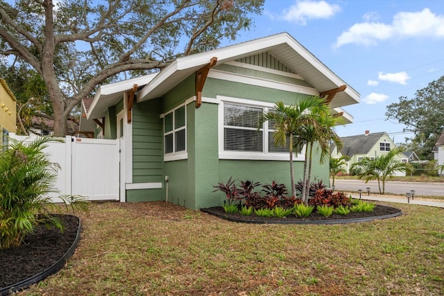 view of home's exterior with a yard