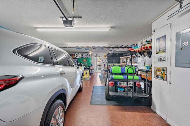 garage featuring a garage door opener and electric panel