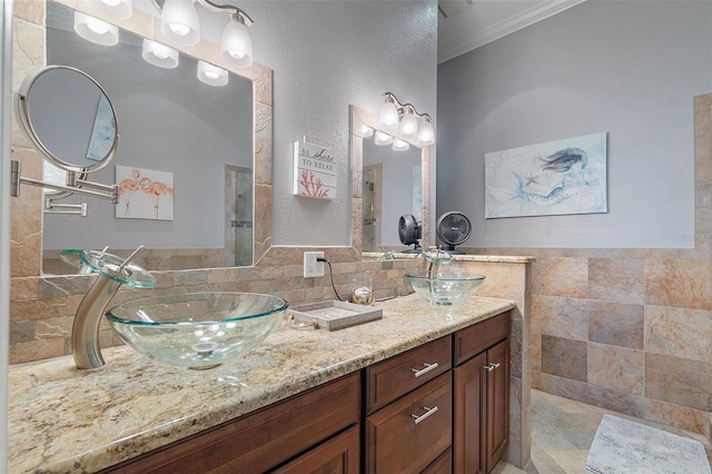 bathroom with vanity and crown molding