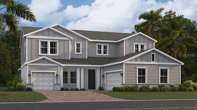 view of front of property with a garage and a front yard