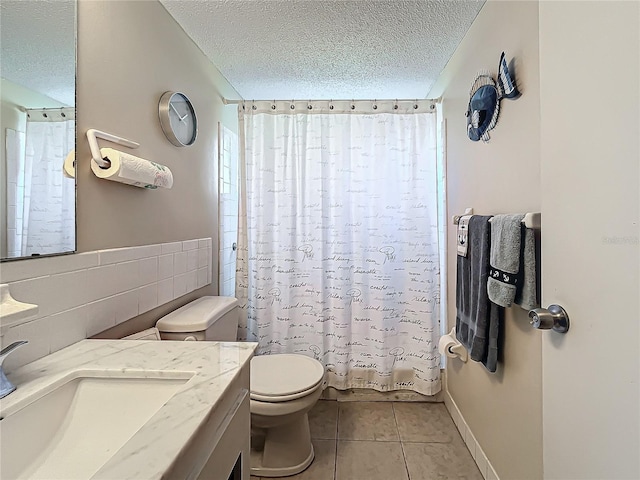 full bathroom featuring toilet, a textured ceiling, vanity, shower / bath combination with curtain, and tile patterned flooring