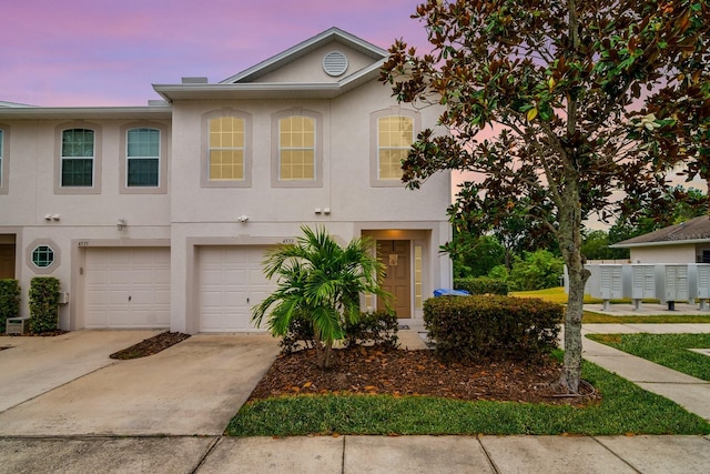 view of front of property with a garage