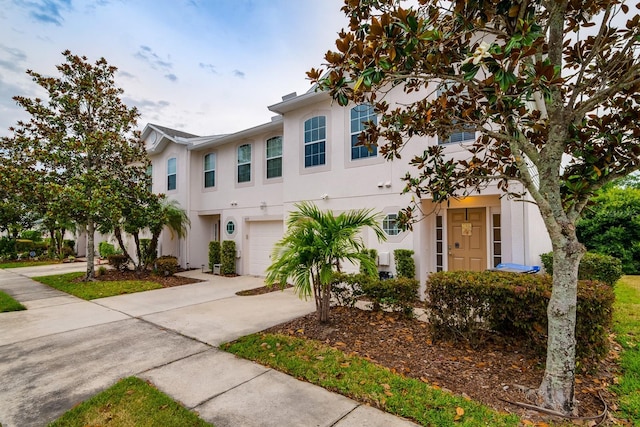 multi unit property featuring a garage