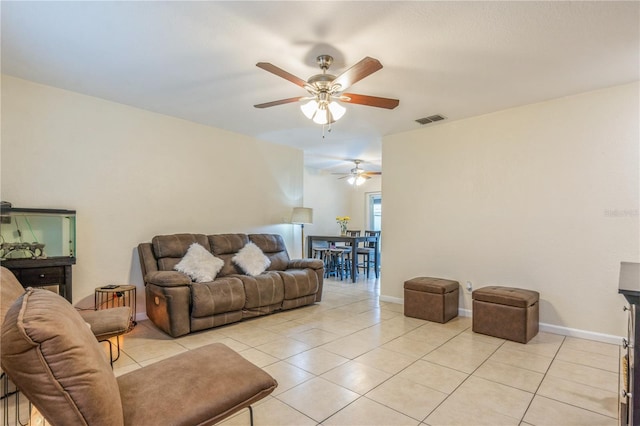 living room with ceiling fan and light tile patterned floors