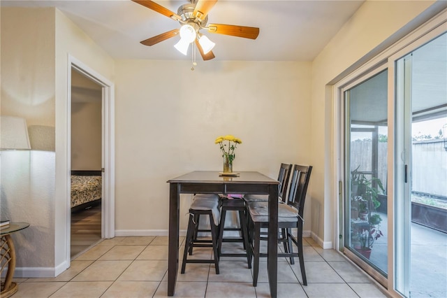 dining room featuring ceiling fan and light tile patterned floors