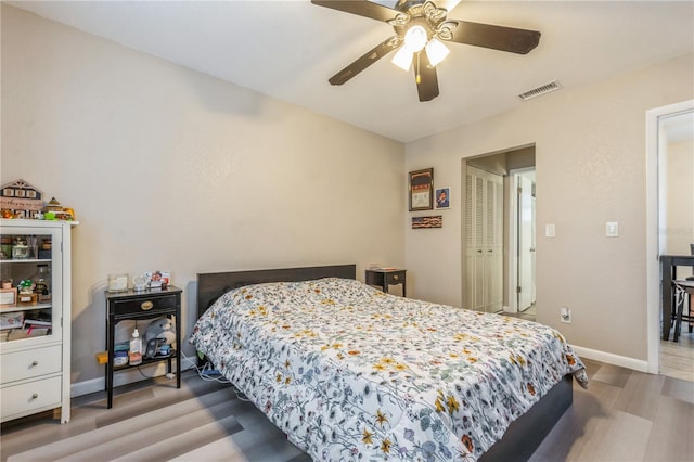 bedroom featuring ceiling fan and light hardwood / wood-style flooring