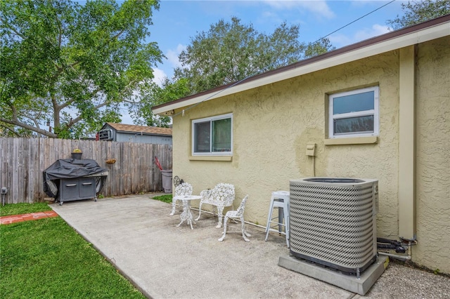 view of patio / terrace with central AC unit