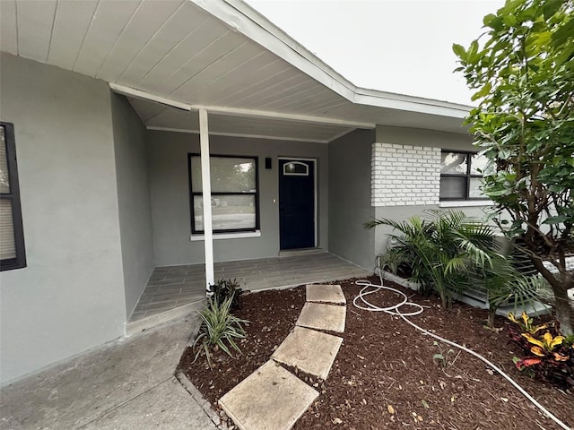 entrance to property with covered porch