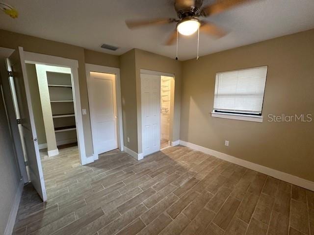 unfurnished bedroom with hardwood / wood-style flooring and ceiling fan