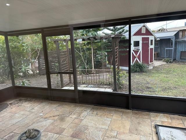 unfurnished sunroom featuring a wealth of natural light