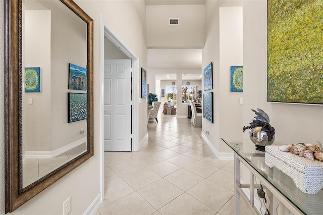 corridor with light tile patterned flooring