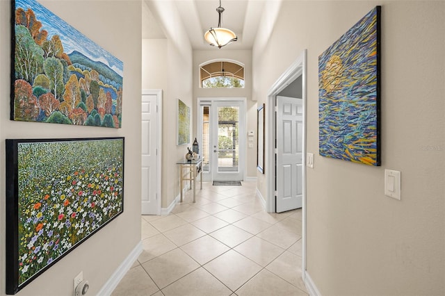 foyer featuring light tile patterned floors