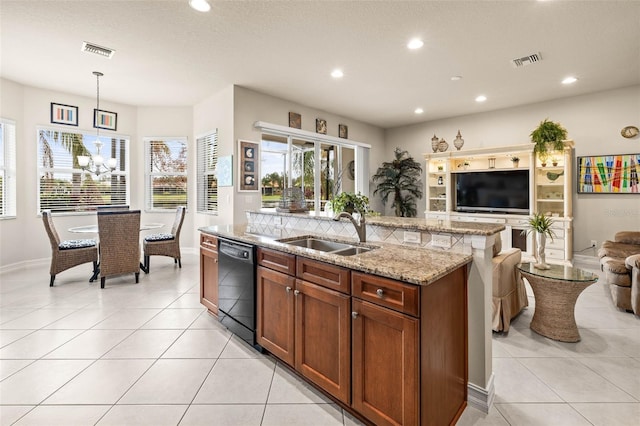 kitchen with dishwasher, sink, pendant lighting, a center island with sink, and light tile patterned flooring