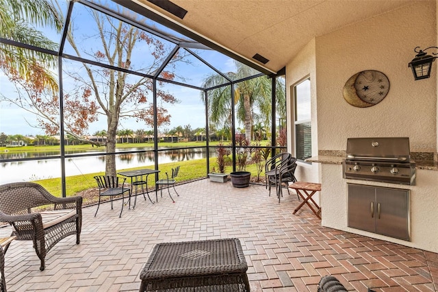 sunroom featuring a water view and lofted ceiling