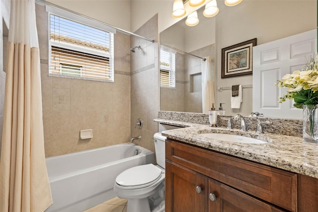 full bathroom featuring tile patterned floors, toilet, vanity, and shower / bathtub combination with curtain