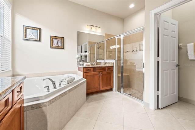 bathroom featuring separate shower and tub, tile patterned floors, and vanity