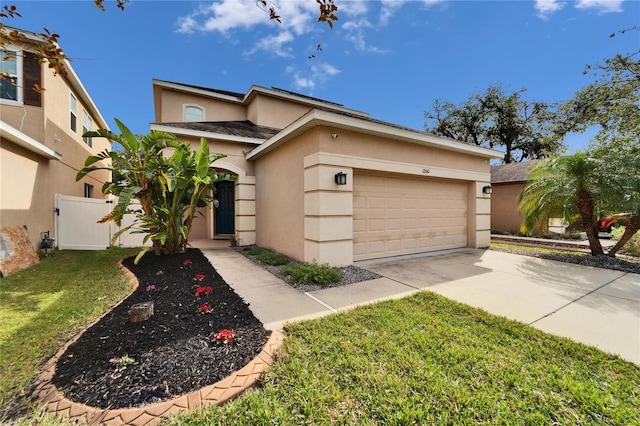 view of front of house with a front lawn and a garage