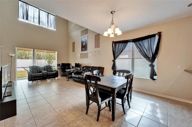 tiled dining space featuring a chandelier