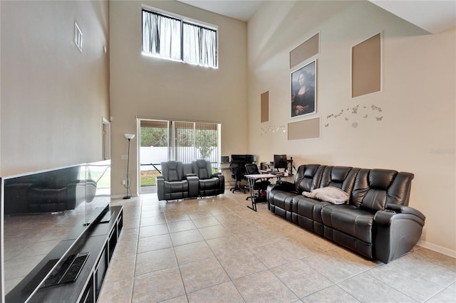 tiled living room with a high ceiling