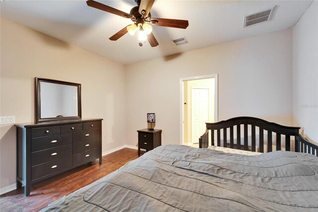 bedroom with ceiling fan and hardwood / wood-style floors