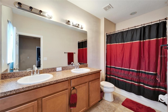 full bathroom with toilet, vanity, and shower / tub combo with curtain