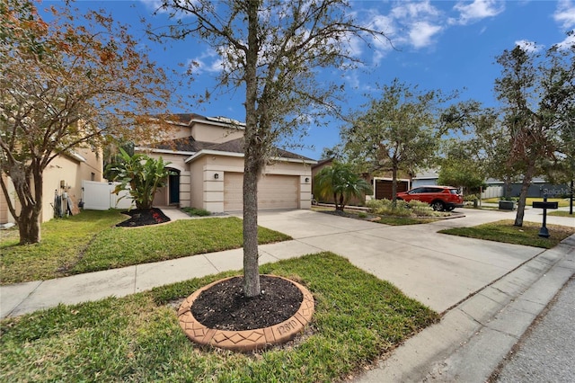 view of front facade featuring a garage and a front yard